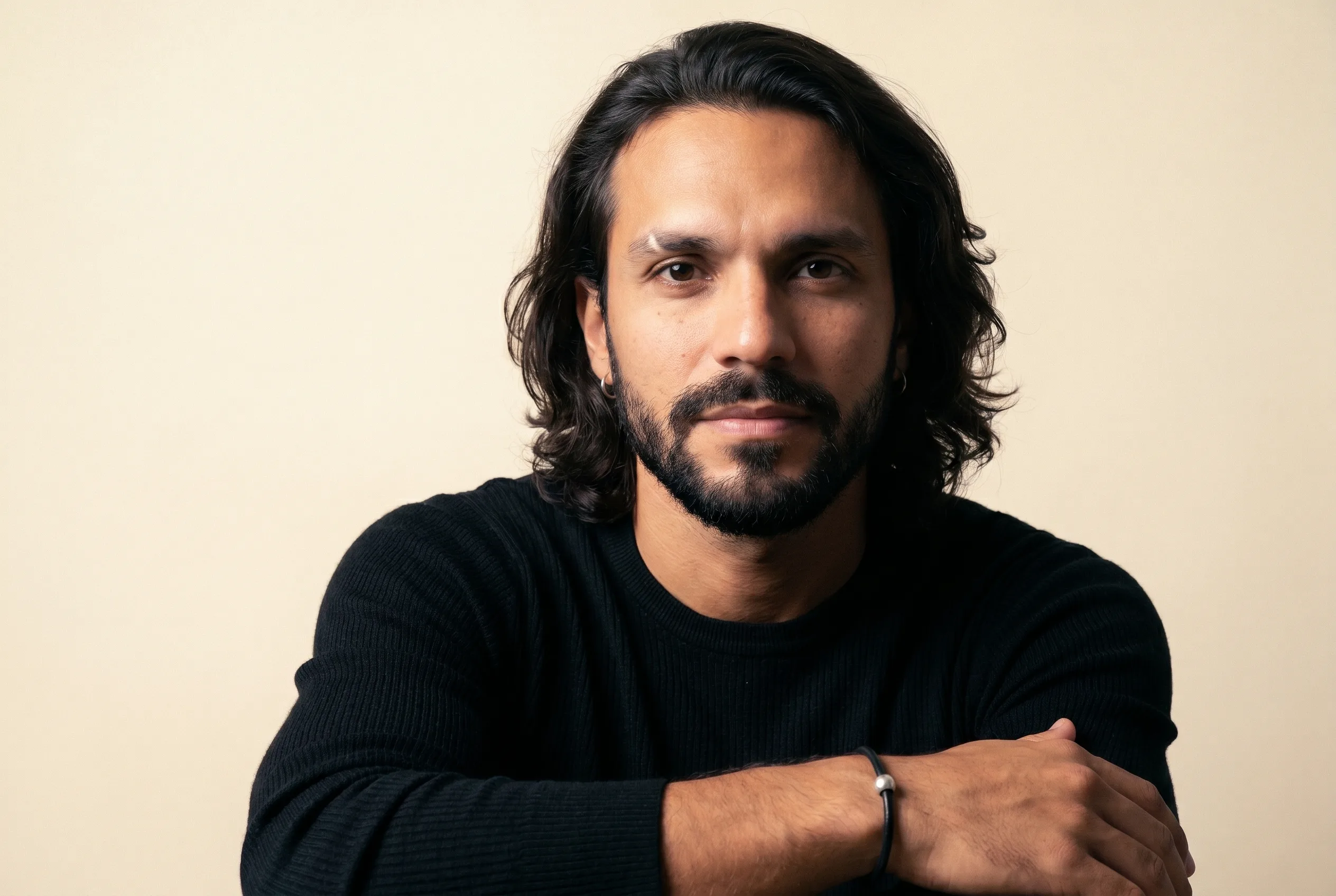 A São Paulo AI ad operator with calm direct gaze on a warm-cream backdrop, Playcut Imagen generation