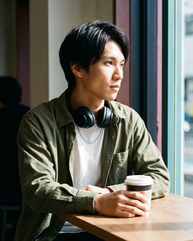 The same AI influencer persona in a café feed-post still, the identity locked from one saved reference so it stays the same person across the feed, rendered by the Playcut Actor Engine